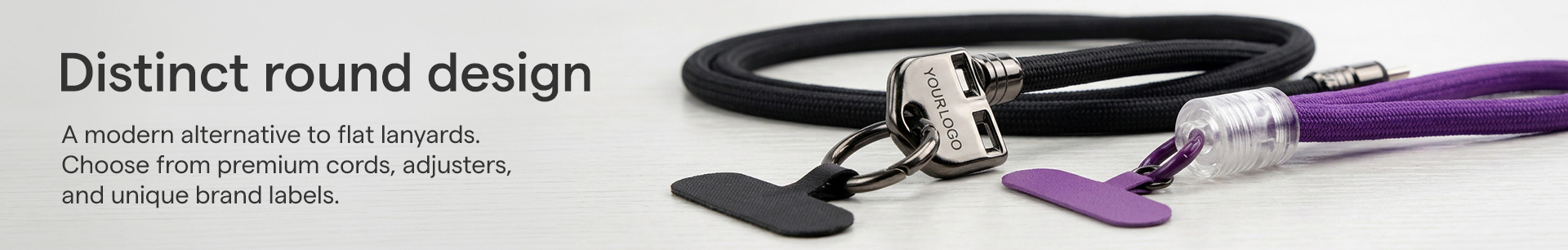 Custom round lanyard with adjustable metal cord lock and phone connector patch for corporate branding[cite: 7, 8].